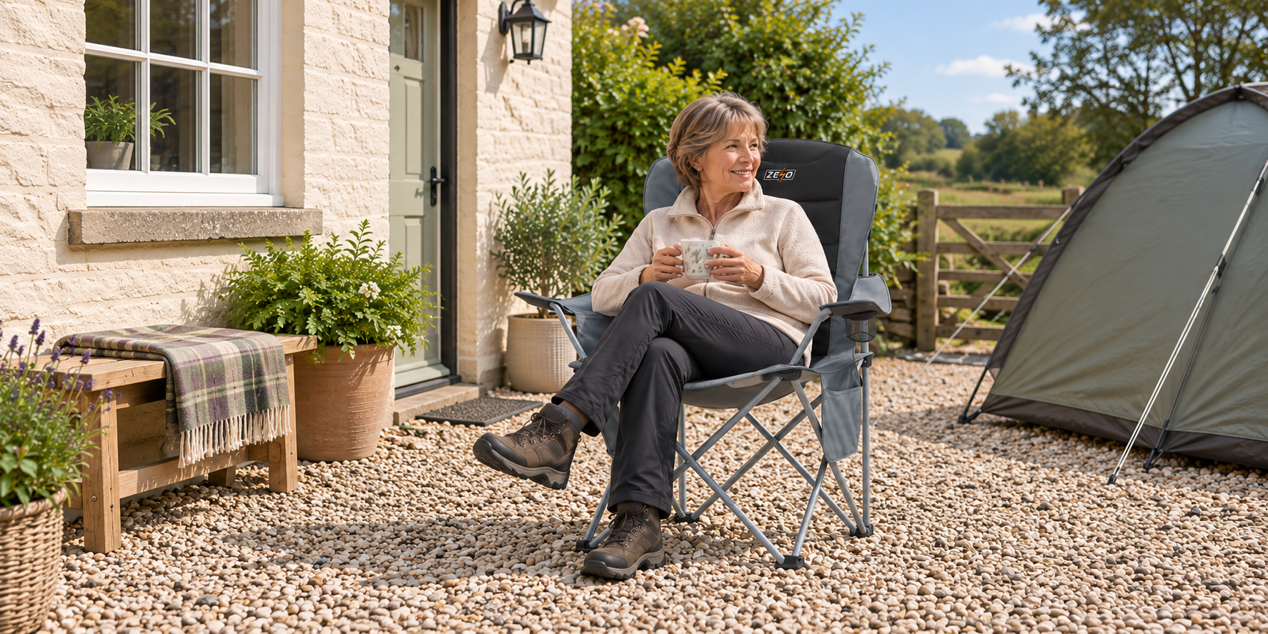 Woman relaxing in a grey ZENO camping chair at a UK campsite